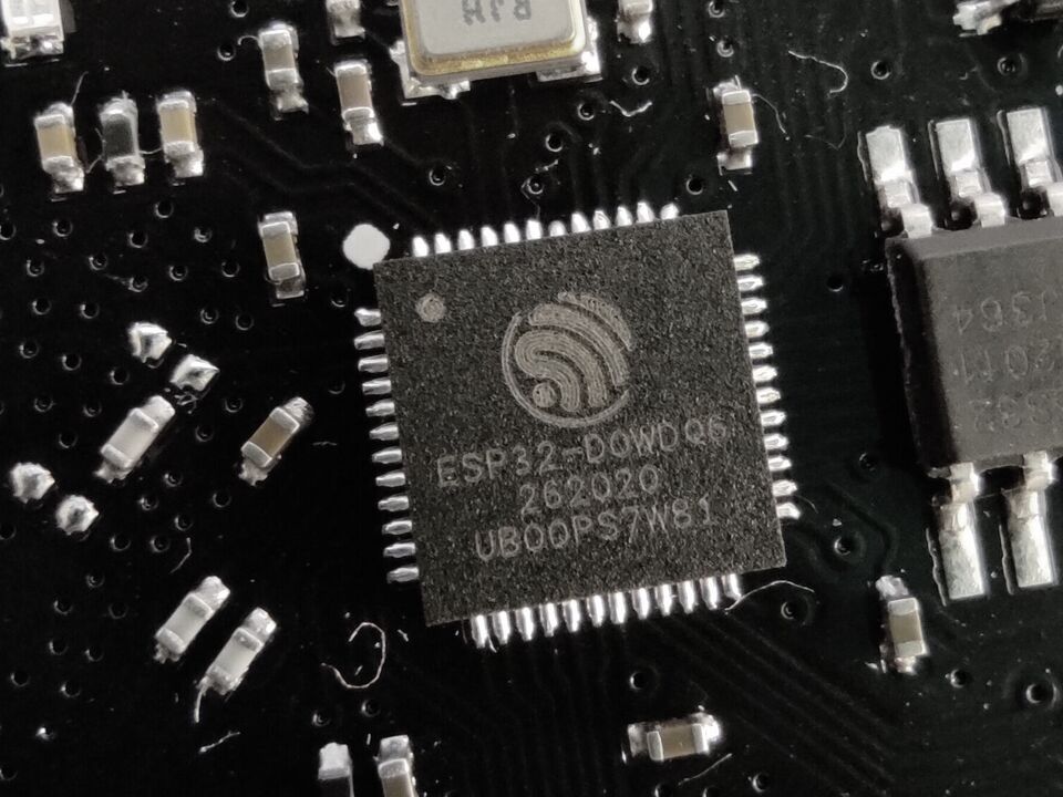 An ESP32 chip on a development board, close up